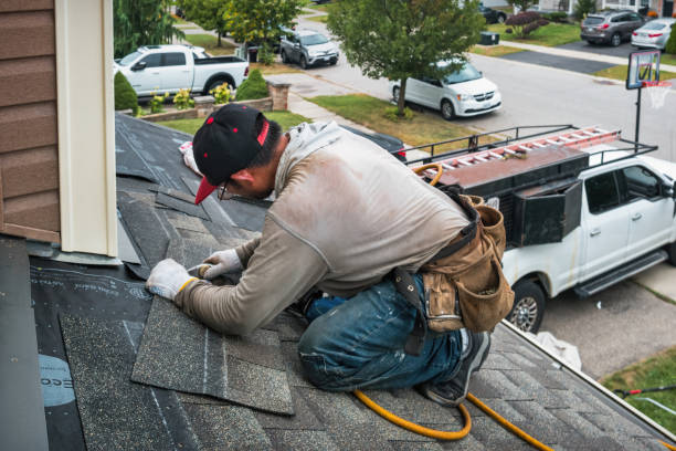 Professional Roof Replacement technician working in Quogue, NY